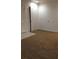 Comfortable living room featuring soft carpeting, neutral walls, and a bright and airy feel at 3345 W Evans Ave, Denver, CO 80219