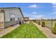 Landscaped backyard featuring a patio, a grill, and a fountain at 8248 S Yantley Ct, Aurora, CO 80016