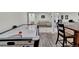 Finished basement featuring an air hockey table and seating area at 8248 S Yantley Ct, Aurora, CO 80016