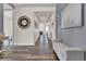 Inviting foyer with hardwood floors, neutral paint, and elegant decor at 8248 S Yantley Ct, Aurora, CO 80016