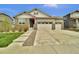 Charming single-Gathering home featuring stone accents, three-car garage, and well-manicured lawn at 8248 S Yantley Ct, Aurora, CO 80016