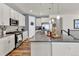 Well-appointed kitchen with a large island, stainless steel appliances, and modern cabinetry at 8248 S Yantley Ct, Aurora, CO 80016