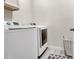 Well-equipped laundry room featuring modern washer and dryer units at 8248 S Yantley Ct, Aurora, CO 80016
