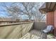 Nice balcony with a chair, stool and views of the surrounding neighborhood at 3050 W 32Nd Ave # 202C, Denver, CO 80211