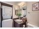 Functional bathroom featuring a stacked washer/dryer and vanity at 3050 W 32Nd Ave # 202C, Denver, CO 80211