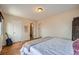 Spacious bedroom with wood floors, multiple doors, and neutral decor at 3050 W 32Nd Ave # 202C, Denver, CO 80211
