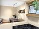Dining area featuring a table with seating and a framed picture on a shelf at 3050 W 32Nd Ave # 202C, Denver, CO 80211