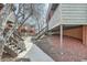 Inviting exterior view featuring walkways and building architecture with wood accents and mature trees at 3050 W 32Nd Ave # 202C, Denver, CO 80211