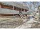 Beautiful exterior view of a home featuring a staircase, green lawn, and mature trees at 3050 W 32Nd Ave # 202C, Denver, CO 80211