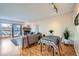Inviting living room and dining area with hardwood floors, natural light, and modern decor at 3050 W 32Nd Ave # 202C, Denver, CO 80211