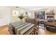 Open concept living room with a dining area, fireplace, and sliding glass door to a deck at 3050 W 32Nd Ave # 202C, Denver, CO 80211
