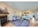 Inviting living room with a brick fireplace and a stylish area rug at 3050 W 32Nd Ave # 202C, Denver, CO 80211