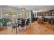 Open dining room with access to the kitchen and outdoor view at 6100 Apache Dr, Larkspur, CO 80118