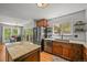 Updated kitchen with stainless steel appliances, granite counters, and island at 6100 Apache Dr, Larkspur, CO 80118