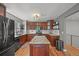 Well-equipped kitchen with granite countertops, island and wooden cabinets at 6100 Apache Dr, Larkspur, CO 80118