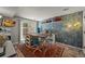 Versatile studio space with a large work table, ample lighting, and sliding glass doors at 6100 Apache Dr, Larkspur, CO 80118