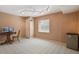 Finished basement featuring neutral carpet, desk, and mini fridge with overhead track lighting at 19653 E Ida Dr, Aurora, CO 80015