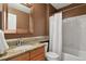 Bathroom features vanity with granite countertop, and shower with tub at 19653 E Ida Dr, Aurora, CO 80015