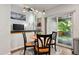 Living area with dining area, sliding glass doors, and vaulted ceiling at 19653 E Ida Dr, Aurora, CO 80015