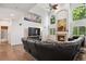 Bright living room boasts high ceilings, modern decor, and cozy fireplace feature at 19653 E Ida Dr, Aurora, CO 80015