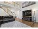 Beautiful living room featuring a loft, staircase and television at 19653 E Ida Dr, Aurora, CO 80015