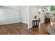 Spacious living area with hardwood floors, open layout, and easy access to staircase at 19653 E Ida Dr, Aurora, CO 80015
