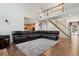 Bright living room features high ceilings and is adjacent to staircase and open-concept kitchen at 19653 E Ida Dr, Aurora, CO 80015
