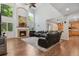 Bright living room with high ceilings, grand fireplace, hardwood floors, and large windows at 19653 E Ida Dr, Aurora, CO 80015