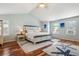 This main bedroom features vaulted ceilings, a king bed, and plentiful natural light at 19653 E Ida Dr, Aurora, CO 80015