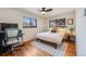 This bedroom features a work space and closet space at 1166 Krameria St, Denver, CO 80220