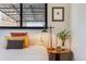 Bedroom featuring a patterned bedside table, accent lamp, and a small potted plant on the nightstand at 1166 Krameria St, Denver, CO 80220