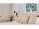 This bedroom features neutral walls and light colored pillows at 1166 Krameria St, Denver, CO 80220
