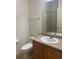 Bathroom featuring sink, toilet, and towel rack at 9300 E Florida Ave # 608, Denver, CO 80247