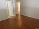 Bright bedroom features wood-look floors and white walls at 9300 E Florida Ave # 608, Denver, CO 80247