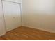 Bedroom featuring wood-look floors and sliding closet doors at 9300 E Florida Ave # 608, Denver, CO 80247