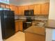 Kitchen featuring oak cabinets, modern appliances, and neutral countertops at 9300 E Florida Ave # 608, Denver, CO 80247