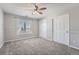 Well-lit bedroom with double door closet and carpet at 7119 S Riviera St, Aurora, CO 80016