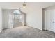 Spacious bedroom with vaulted ceiling, carpet, and large window at 7119 S Riviera St, Aurora, CO 80016