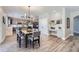 Kitchen breakfast nook with gray chairs and modern chandelier at 7119 S Riviera St, Aurora, CO 80016