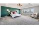 Relaxing main bedroom featuring an accent wall and plush bedding at 7119 S Riviera St, Aurora, CO 80016