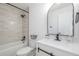 Bathroom with updated fixtures, subway tile shower, modern vanity, and new toilet at 2232 Coronado Pkwy # B, Denver, CO 80229