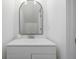 Bathroom vanity with white cabinets, quartz counters, modern mirror, and updated fixtures at 2232 Coronado Pkwy # B, Denver, CO 80229