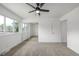Spacious bedroom with a closet, ceiling fan, and new carpet at 2232 Coronado Pkwy # B, Denver, CO 80229