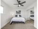 Bedroom with carpeted floors, ceiling fan, and large closet at 2232 Coronado Pkwy # B, Denver, CO 80229