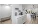 Light-filled entry with a coffee bar, stairs, and view into the living area at 2232 Coronado Pkwy # B, Denver, CO 80229
