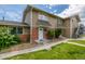 Charming home exterior featuring a well-manicured lawn and brick accents at 2232 Coronado Pkwy # B, Denver, CO 80229