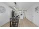 Open floorplan featuring a kitchen with black appliances and breakfast table at 2232 Coronado Pkwy # B, Denver, CO 80229