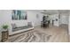 Cozy living room and kitchen area with white sofa and modern decor at 2232 Coronado Pkwy # B, Denver, CO 80229