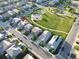 An aerial view of a neighborhood featuring a park and playground with well-maintained lawns at 5425 E 125Th Pl, Thornton, CO 80241