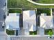 An aerial view of three homes showing their roofs, driveways, and well-maintained lawns at 5425 E 125Th Pl, Thornton, CO 80241